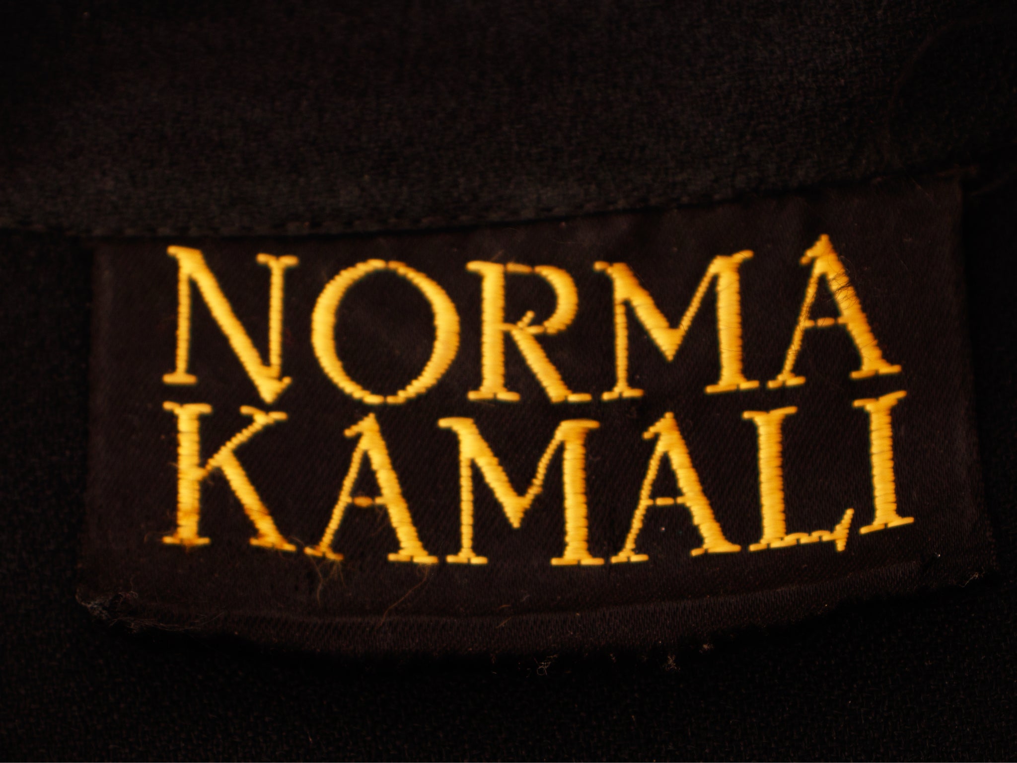Norma Kamali Crepe Pleated Romper