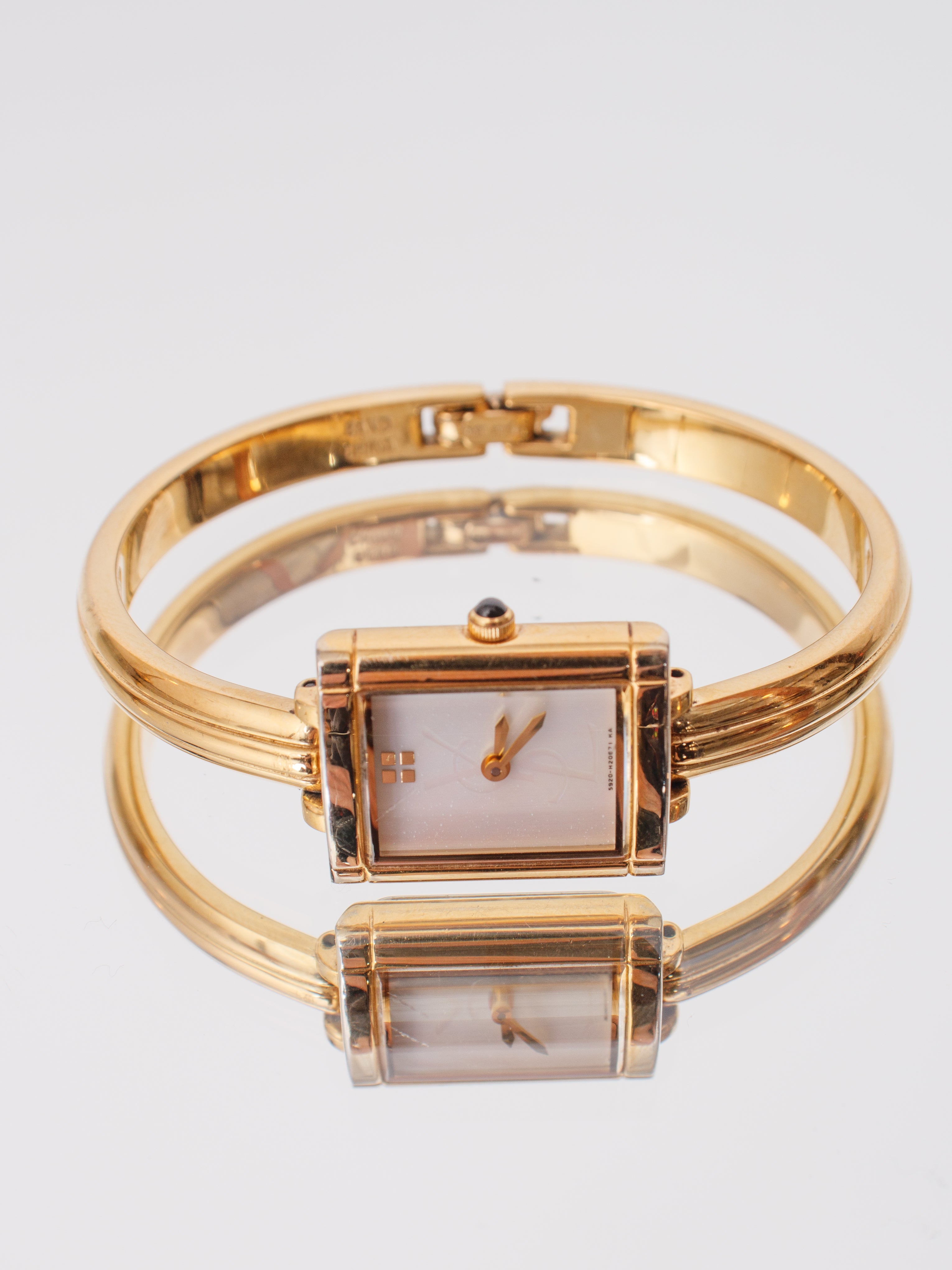 YVES SAINT LAURENT ゴールド ハンマード バングル 1990s Yves Saint Laurent Bangle Watch | Mercy Vintage
