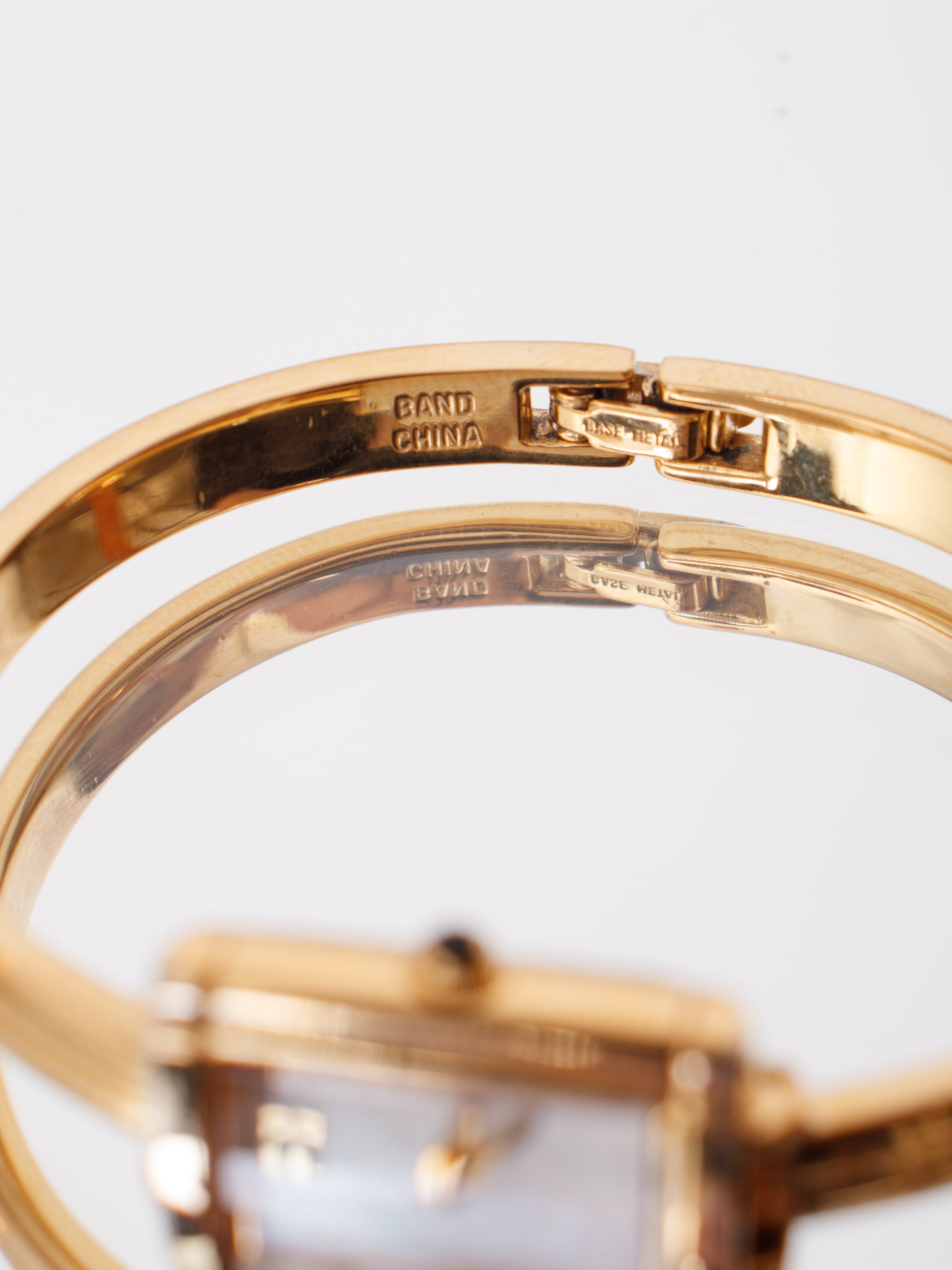 YVES SAINT LAURENT ゴールド ハンマード バングル 1990s Yves Saint Laurent Bangle Watch | Mercy Vintage